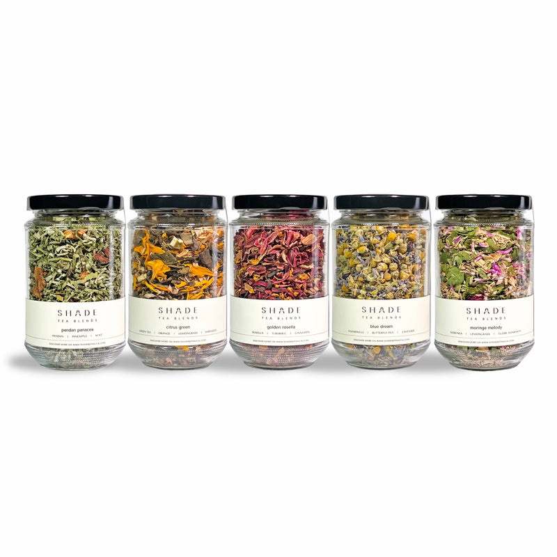 Row of jars of Shade Botanicals Tea Blend on a white background