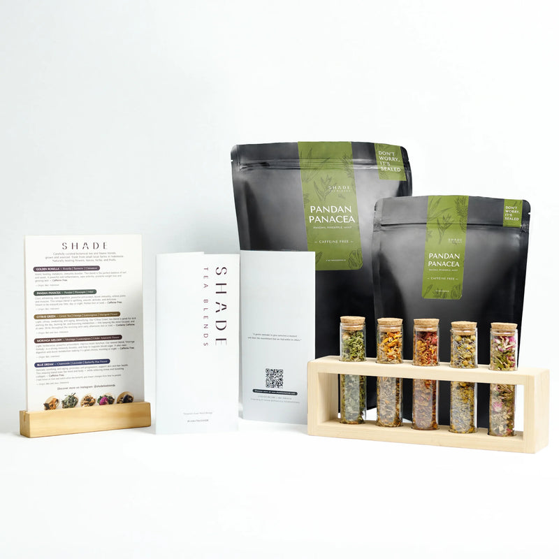 Bags of Shade Botanicals Tea Blend on a white background