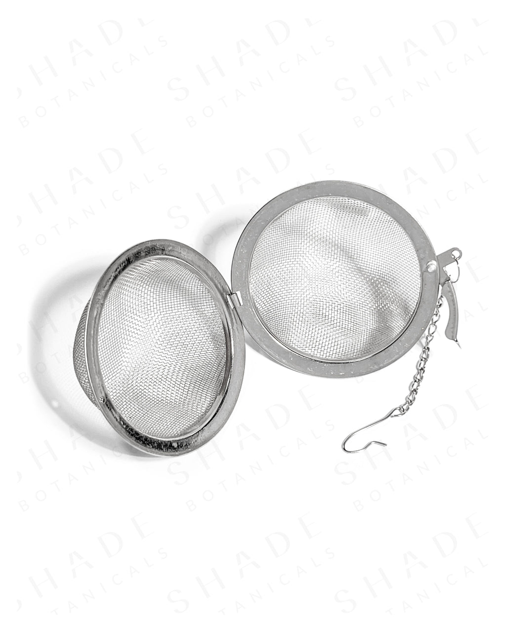 Shade Botanicals stainless steel Grande Brew Globe tea strainer front view with parts opened