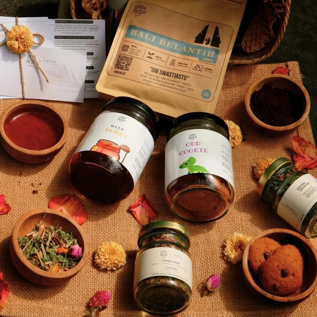 Jars of cookies and tea on a textured surface with decorative elements