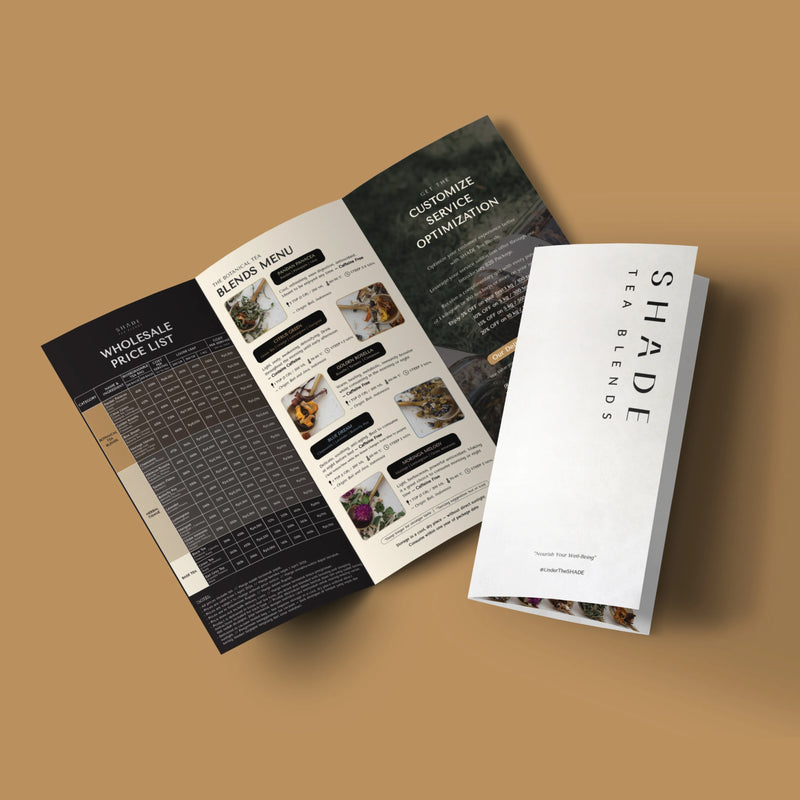 Open brochure of Shade Botanicals Tea Blend on a brown background, featuring 'Shade Tea Blends' branding
