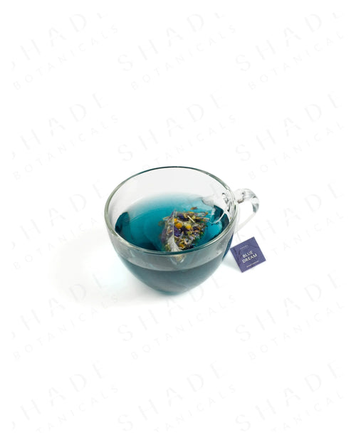Shade Botanicals Blue Dream loose leaf tea served in a glass cup