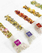 Top view of Shade Botanicals Blue Dream loose leaf tea arranged neatly on a white background 