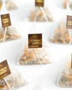 Shade Botanicals Citrus Green loose leaf tea inside a small tea pack