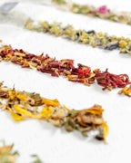 Shade Botanicals Golden Rosella loose leaf tea arranged neatly on a white background