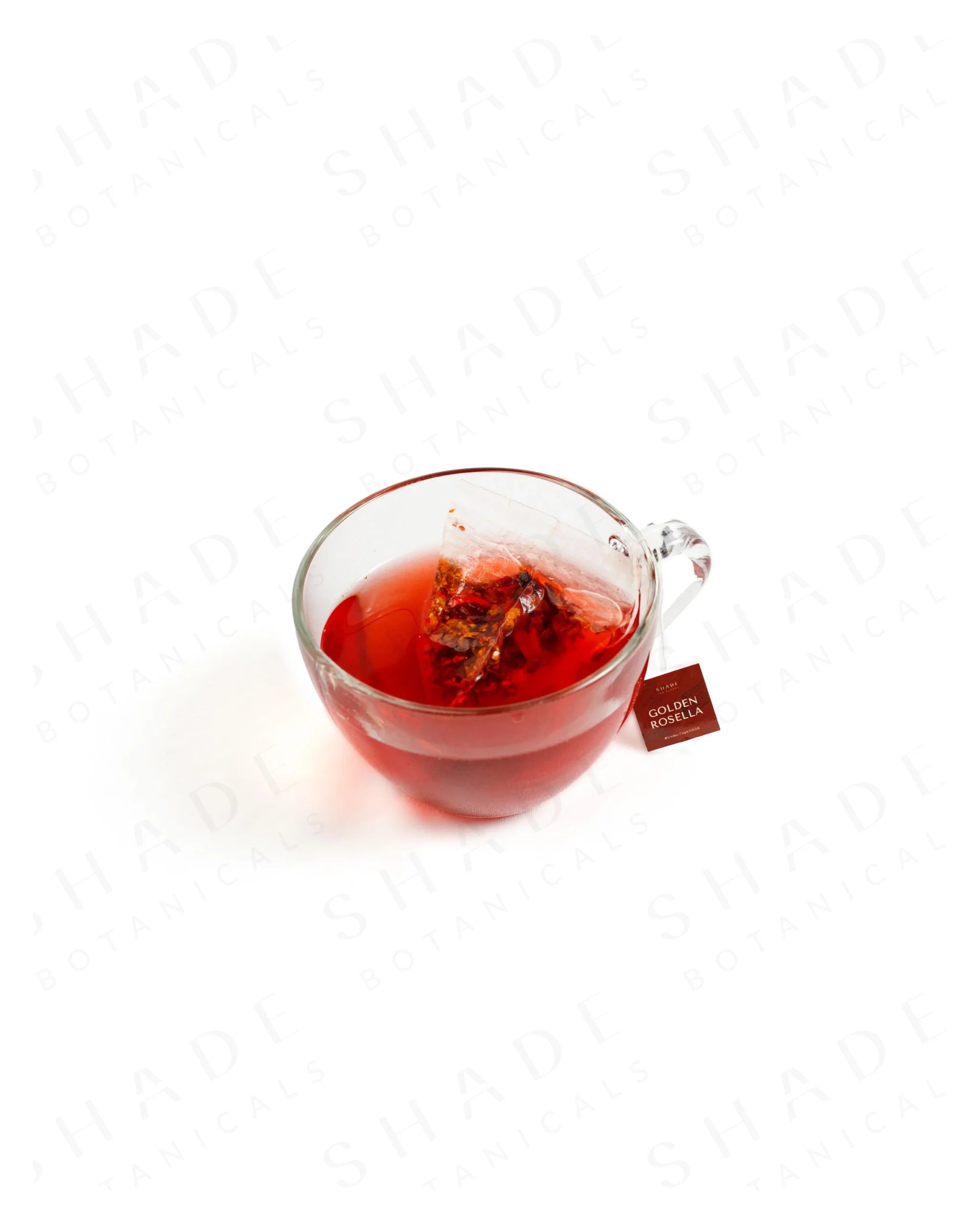 Shade Botanicals Golden Rosella loose leaf tea served in a glass cup
