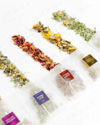 Top view of Shade Botanicals Golden Rosella loose leaf tea arranged neatly on a white background