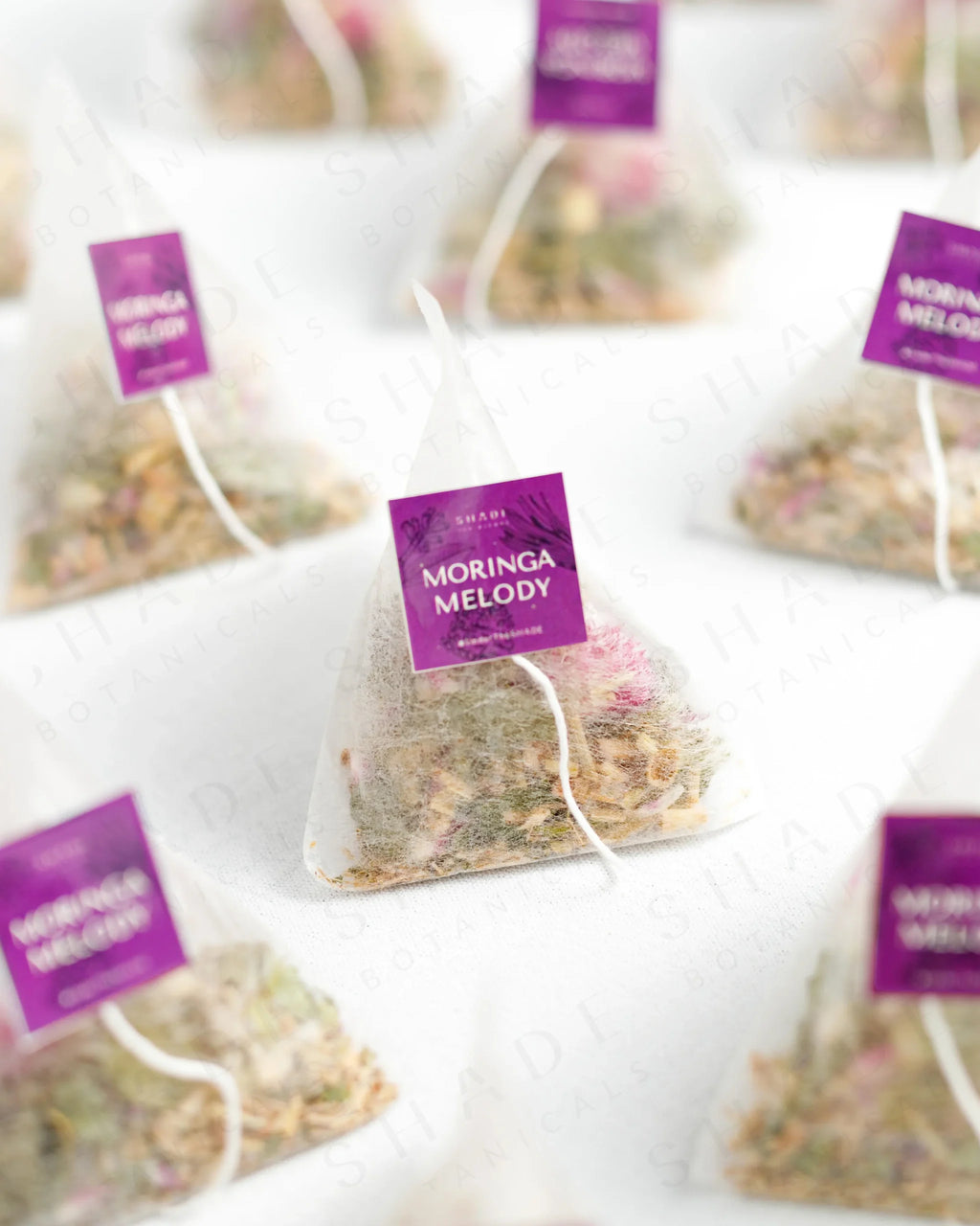 Shade Botanicals Moringa Melody loose leaf tea inside a small tea pack