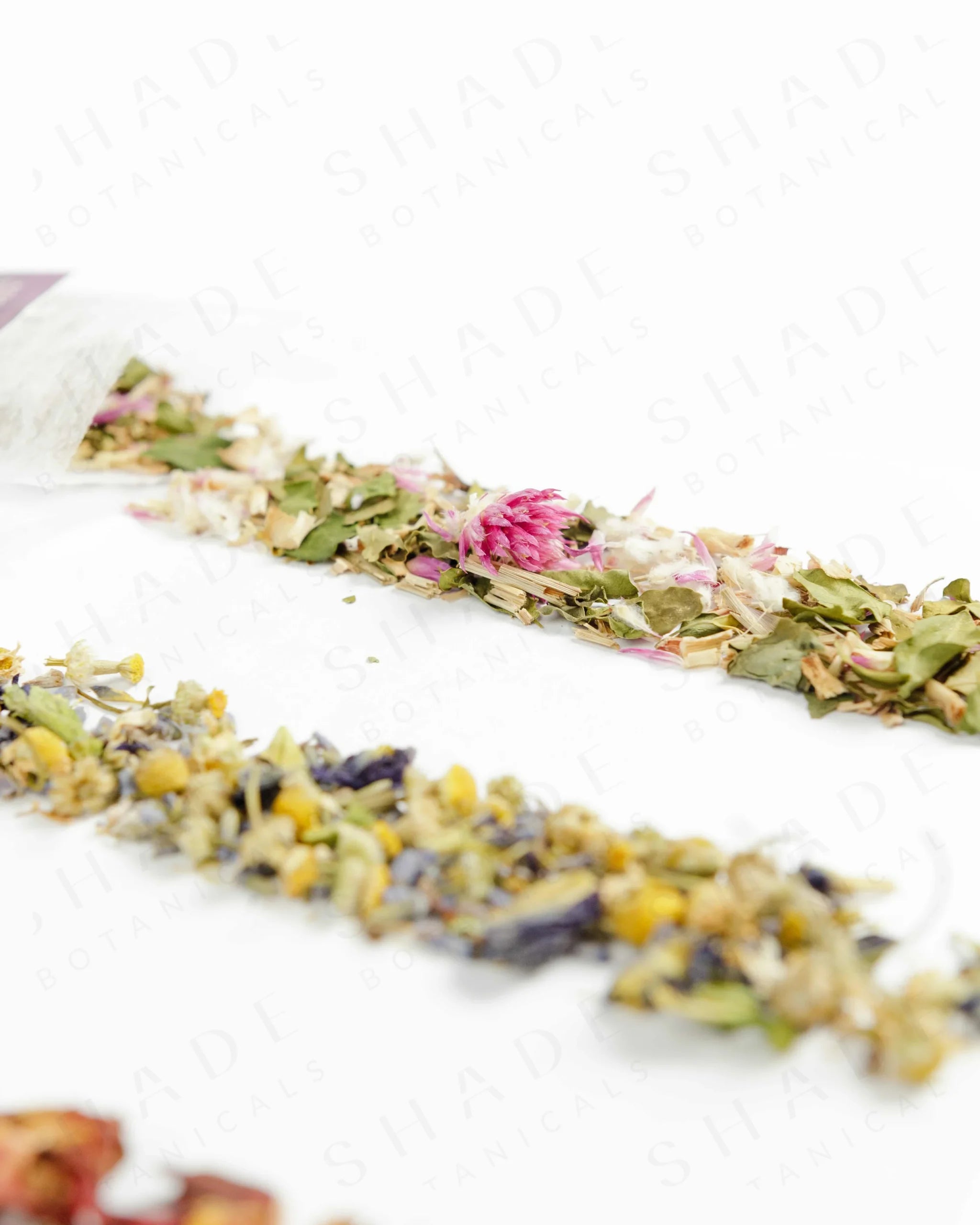 Shade Botanicals Moringa Melody loose leaf tea arranged neatly on a white background
