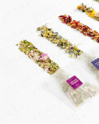 Top view of Shade Botanicals Moringa Melody loose leaf tea arranged neatly on a white background