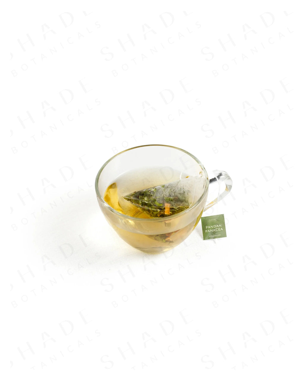 Shade Botanicals Pandan Panacea loose leaf tea served in a glass cup