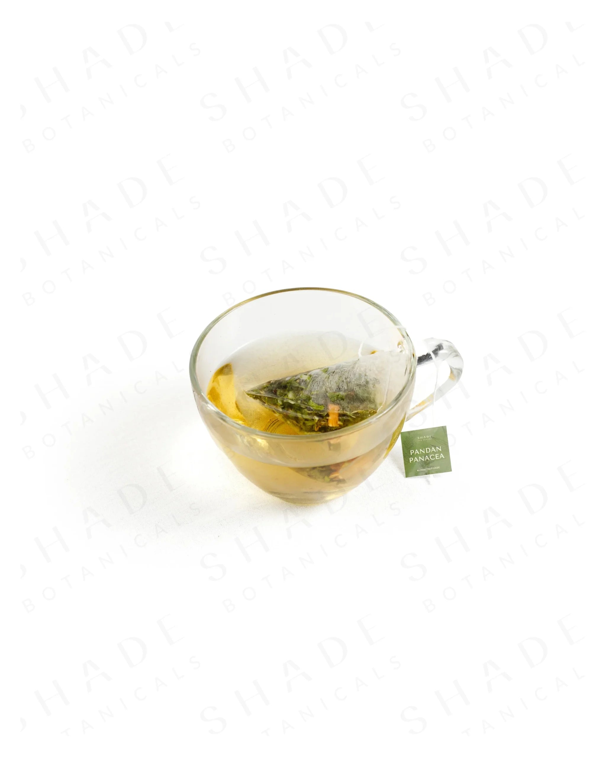 Shade Botanicals Pandan Panacea loose leaf tea served in a glass cup